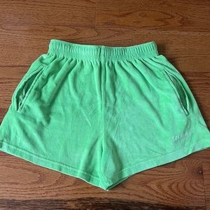 green sweat shorts